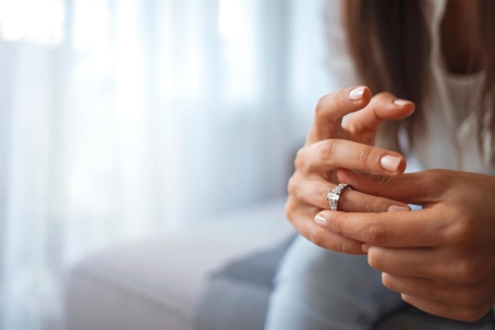 Woman taking off ring